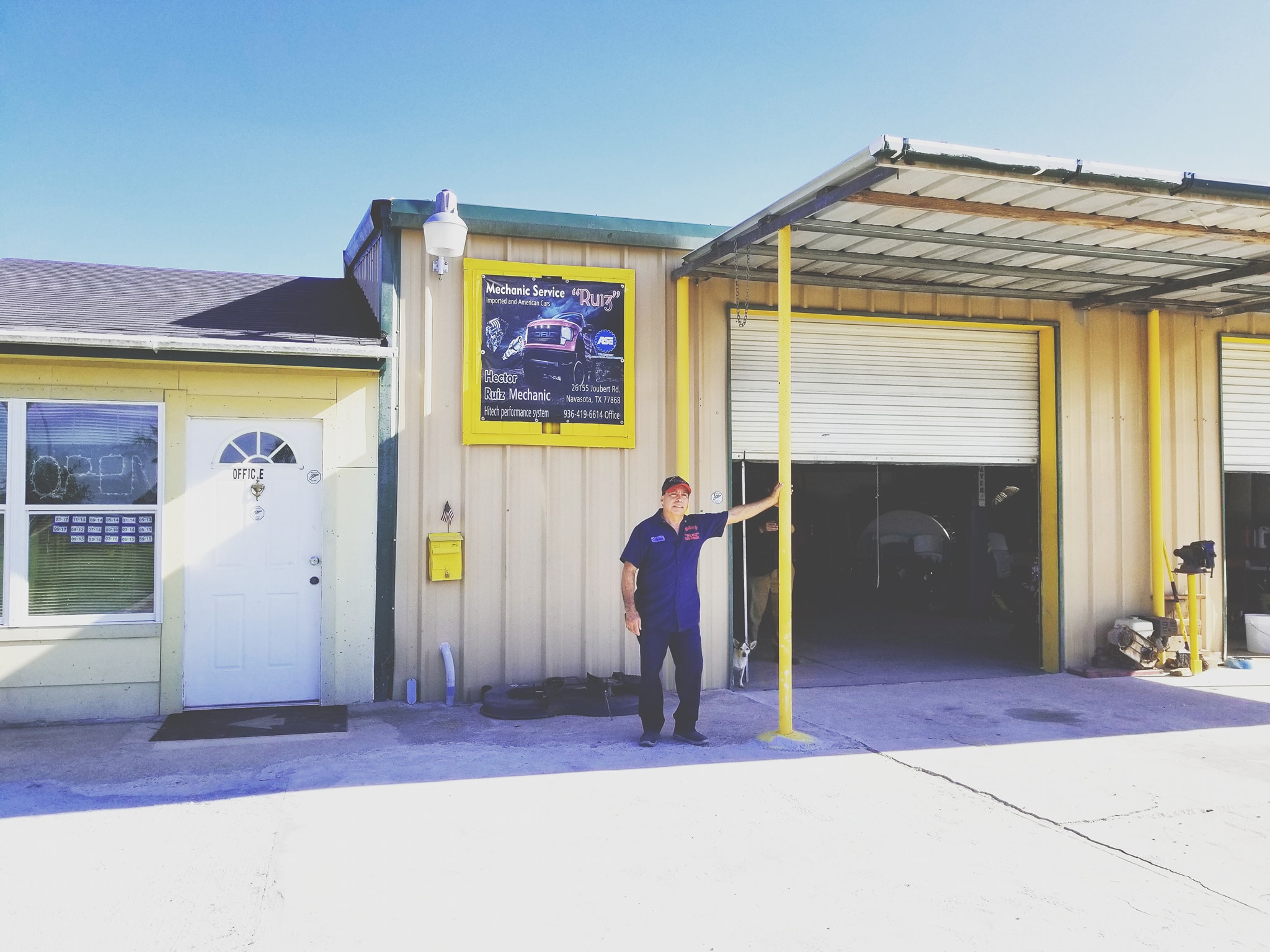 Ruiz standing in front of the shop